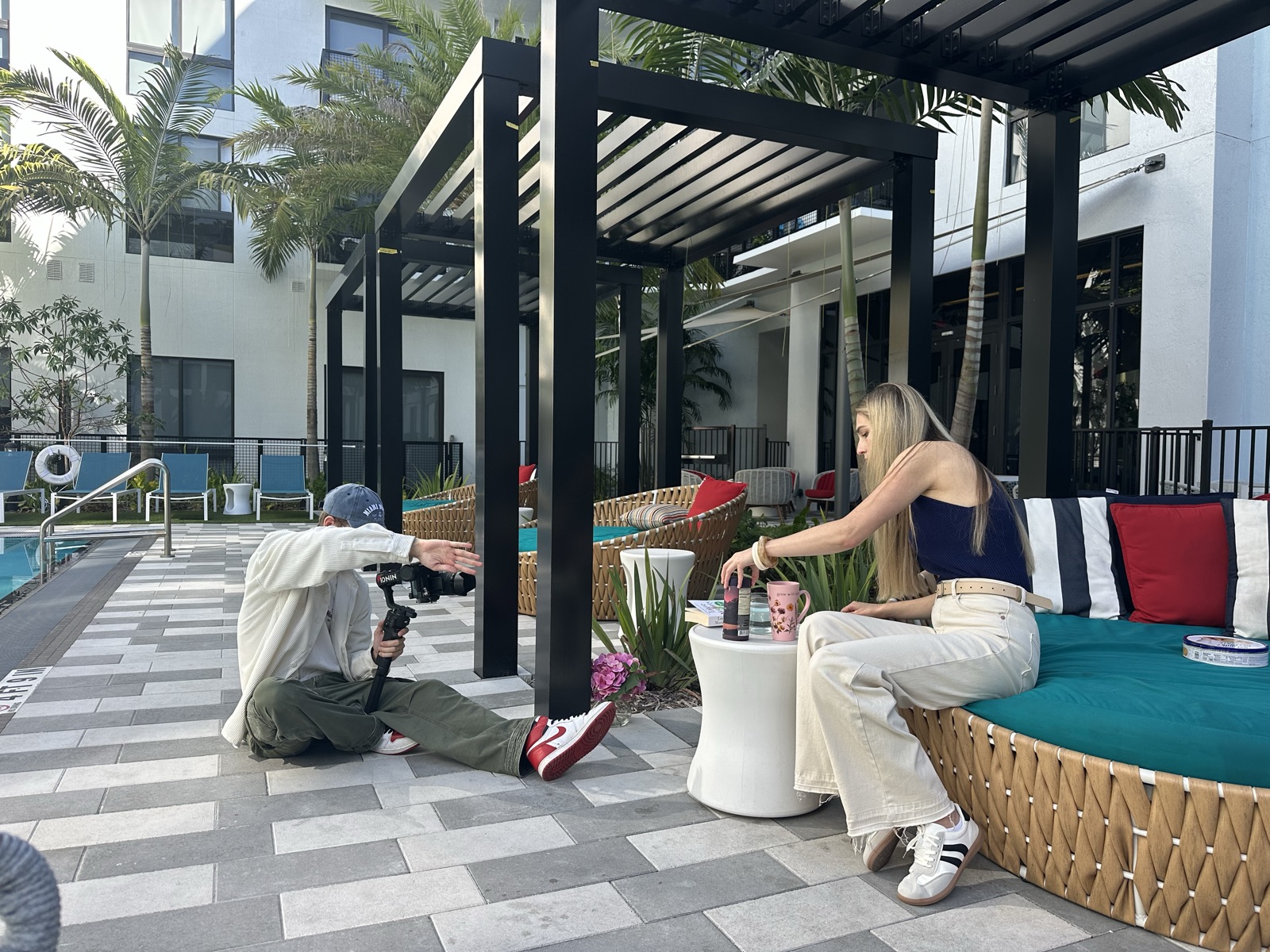 Leon Szczaurski directing a MindBlend lifestyle shoot poolside with a gimbal — Fort Lauderdale